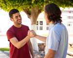 young adult peers shaking hands [enable images to see]