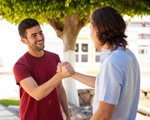 Youth and peer greeting one another [enable images to see]